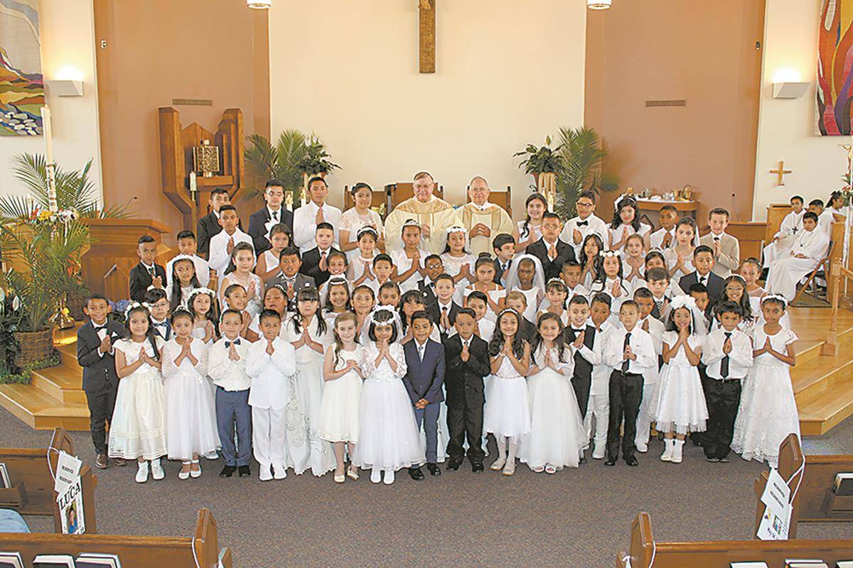 Children at Our Lady of Mercy Church in Winston-Salem received their first Holy Communion during a May 4 Mass offered by Conventual Franciscan Father Carl S. Zdancewicz, pastor. (Photo provided by Alex Moreira)