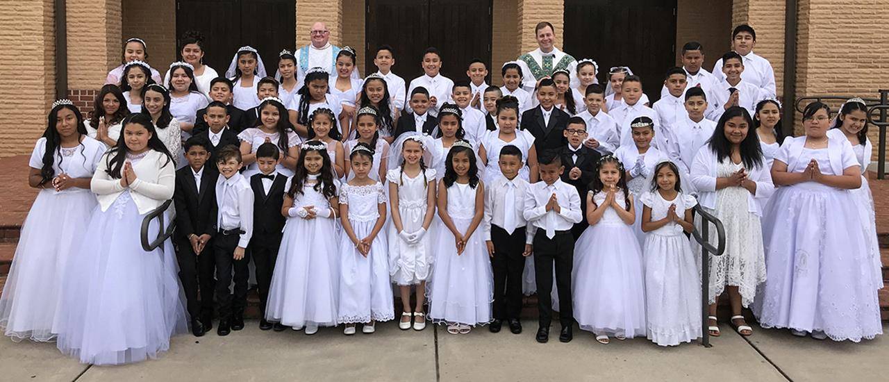 Children of the Hispanic community at Sacred Heart Church in Salisbury received first Holy Communion May 11 during Mass celebrated by Father John Eckert, pastor. (Photos by Bill Washington | Catholic News Herald)