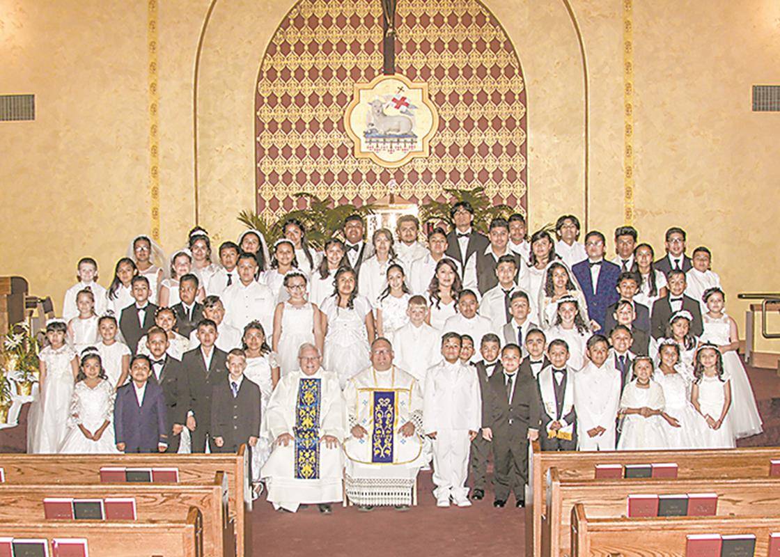 Many children received their first Holy Communion during two Masses celebrated by Father Benjamin Roberts, pastor, at Our Lady of Lourdes Church in Monroe May 4. (Photos provided by Ed Tepera)