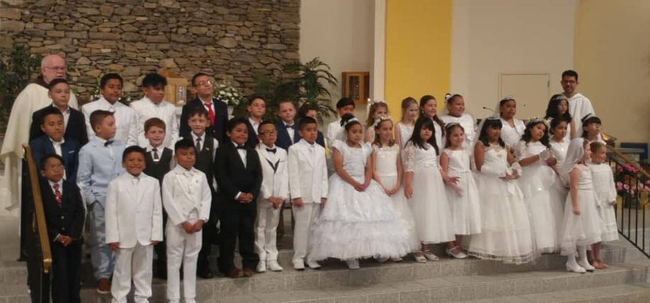 Children at Immaculate Conception Church in Hendersonville received their first Holy Communion during two recent Masses, one said in English and the other in Spanish. (Photos provided)
