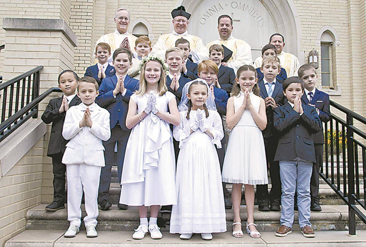 Thirty-one children at St. Patrick Cathedral in Charlotte received their first Holy Communion during Masses celebrated May 4 and May 11. (Photos provided by James Sarkis)