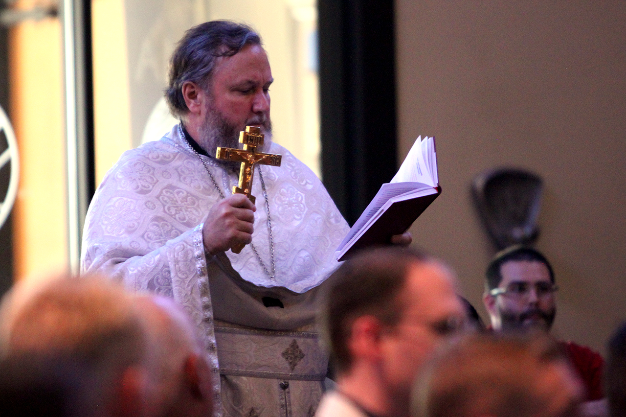 Father Mark Shuey of St. Nicholas Mission in Cary presents the ordinand at the start of the ordination rite, saying, 