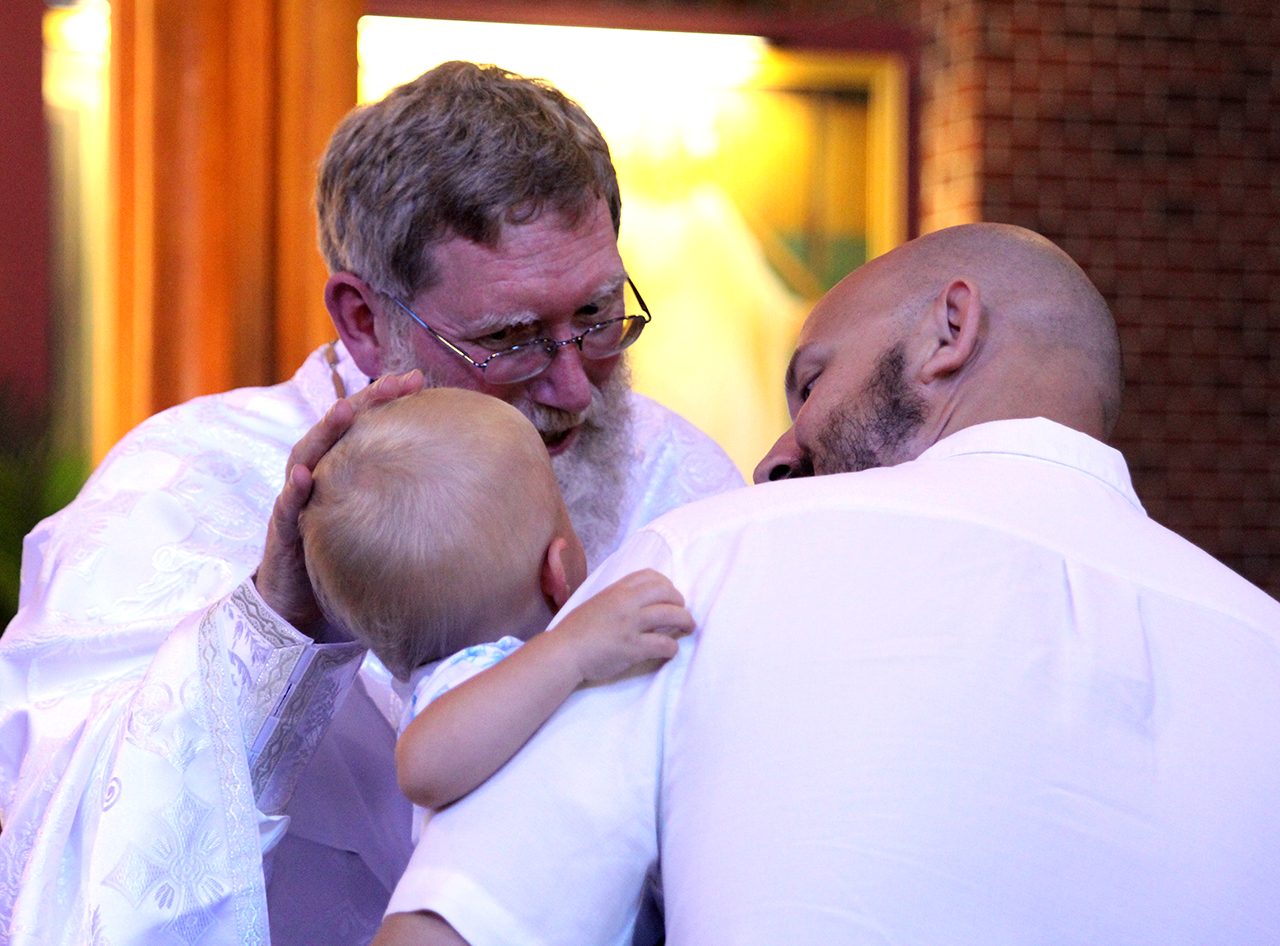 Newly-ordained Father Kevin gives his first priest blessings after his ordination.