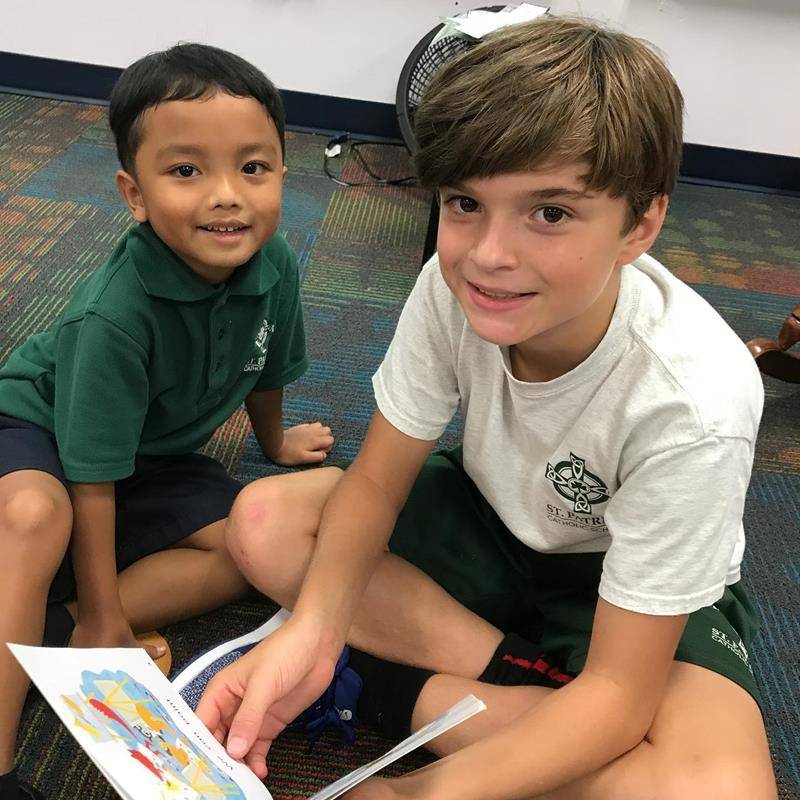 CHARLOTTE — Students spent time with prayer partners and reading during the first few weeks of school at St. Patrick School in Charlotte. (Photos via Facebook)
