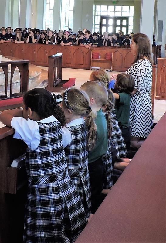 Kindergarteners in the foreground  with 8th graders in the background