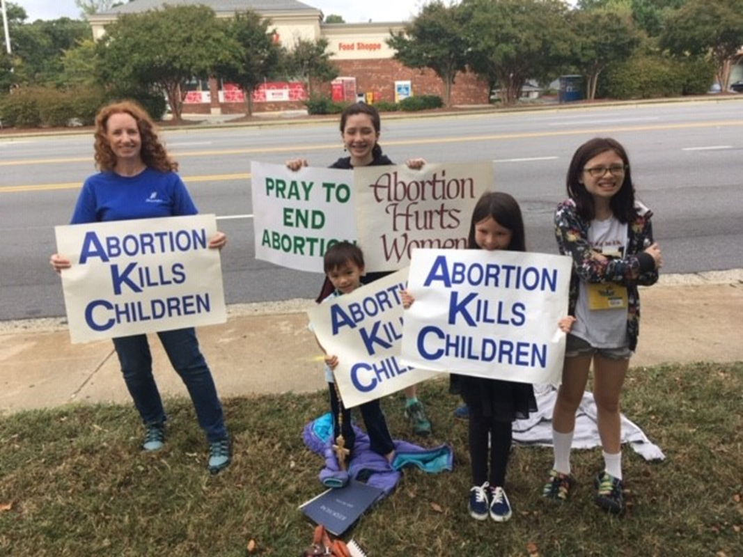 GREENSBORO — Parishioners attend a Life Chain at Our Lady of Grace Church. (Photo provided by Tonya Wong) 