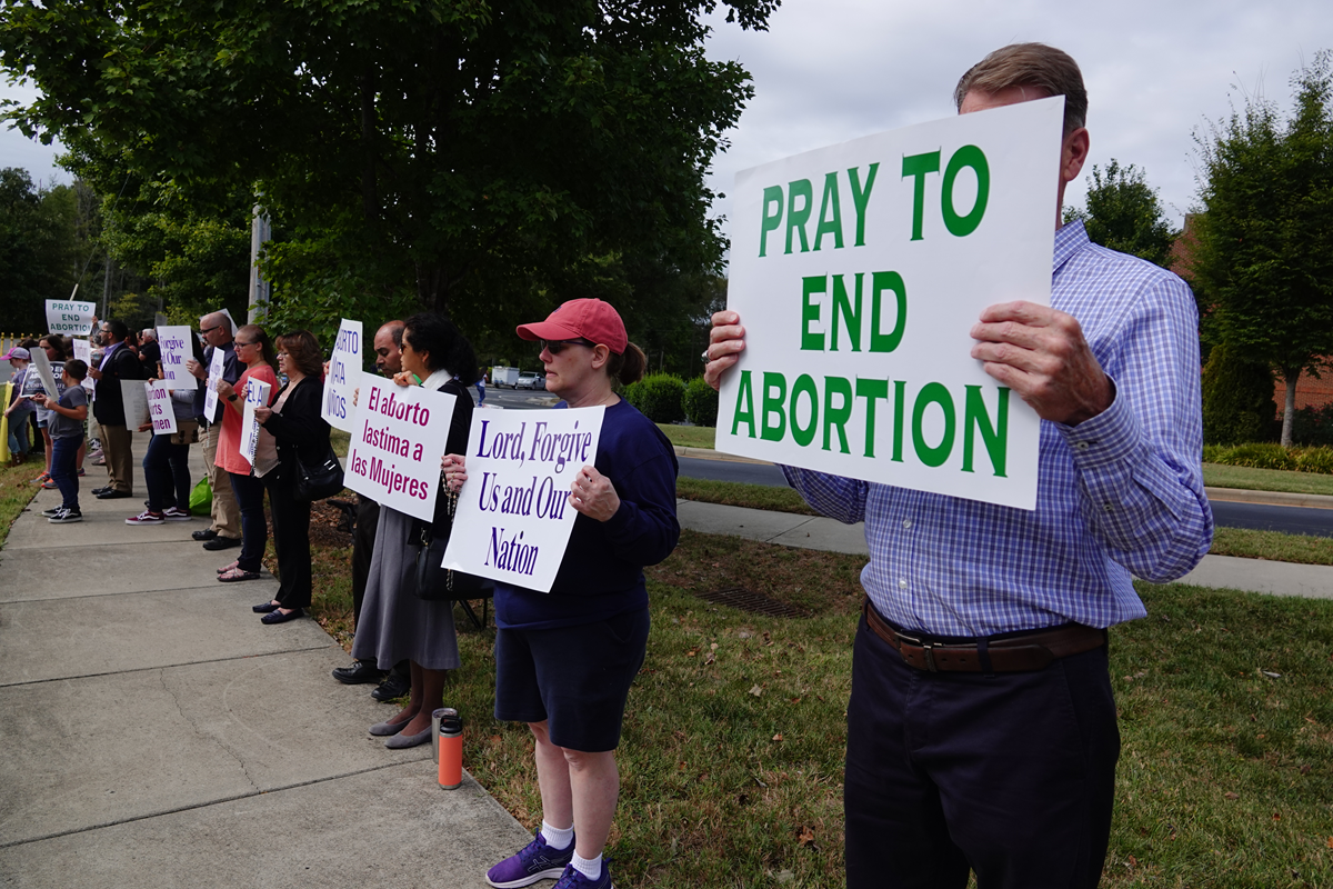 HUNTERSVILLE — More than 200 joined in a Life Chain along the sidewalk in front of St. Mark Church Oct. 6. After the Life Chain, the D3 Foundation Singers performed three of their pro-life songs. (Photos provided by Amy Burger)