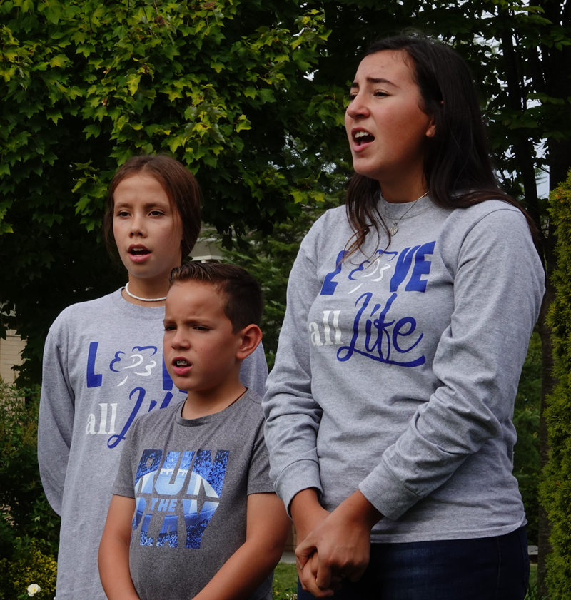 HUNTERSVILLE — More than 200 joined in a Life Chain along the sidewalk in front of St. Mark Church Oct. 6. After the Life Chain, the D3 Foundation Singers performed three of their pro-life songs. (Photos provided by Amy Burger)