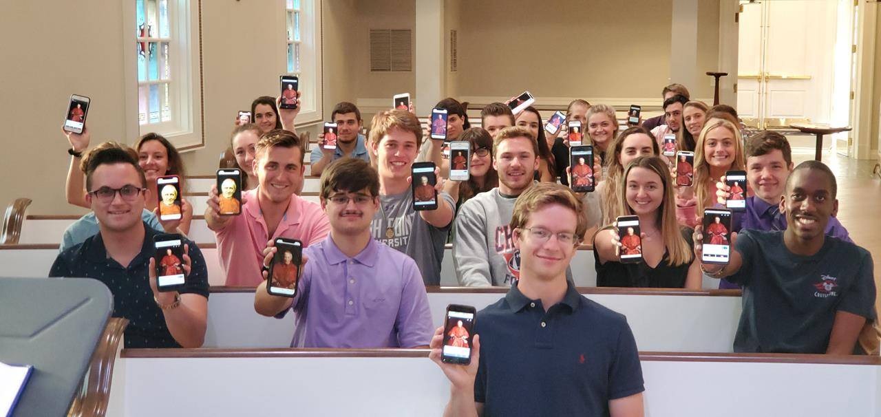 HPU Mass group with Cardinal Newman on phone 1 (Copy)