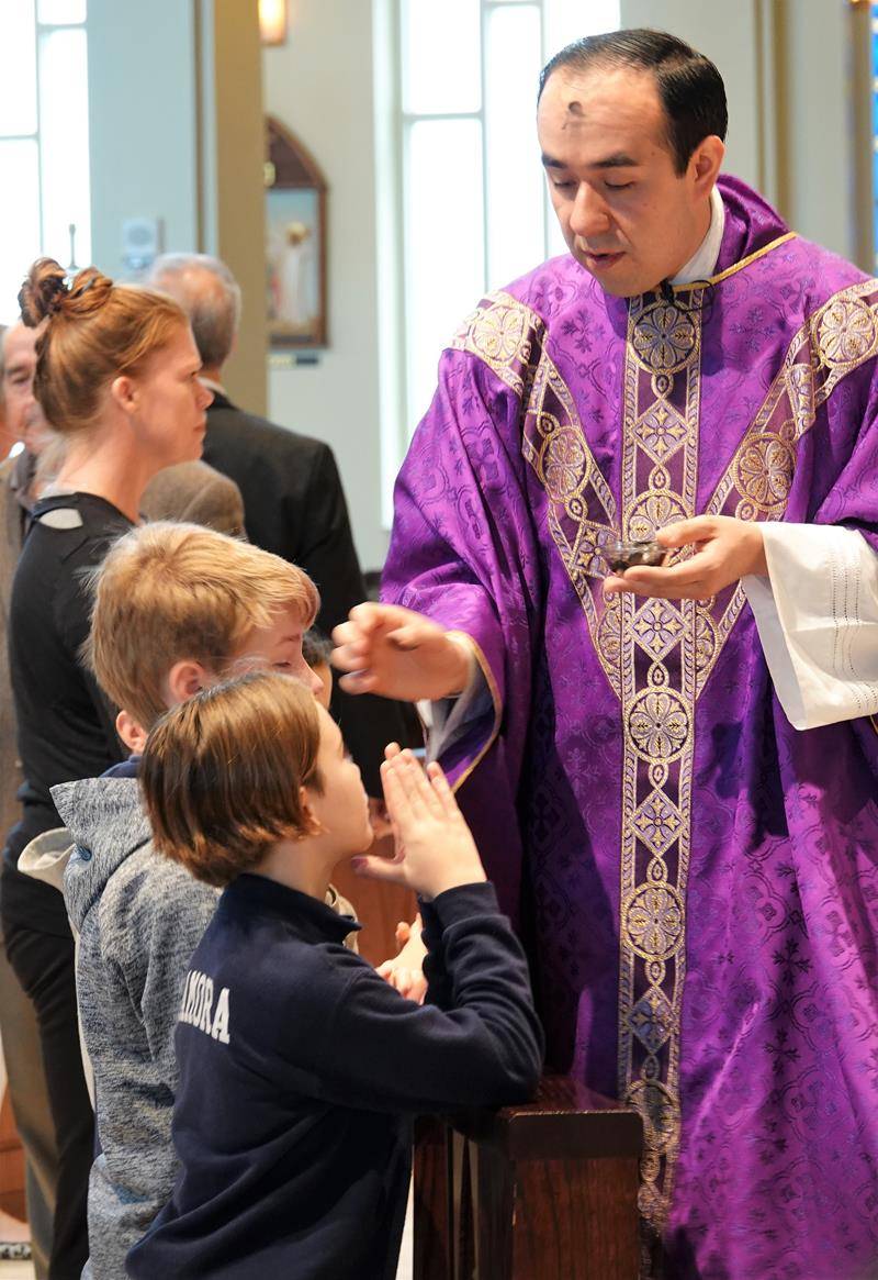 HUNTERSVILLE — St. Mark School students participate in Ash Wednesday Mass at St. Mark Church Feb. 26. (Photos provided by Amy Burger)