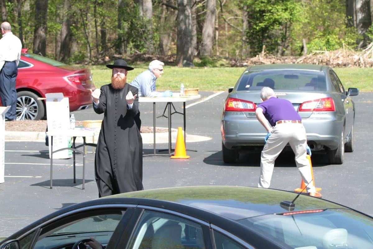Drivers pull up at Holy Cross Church in Kernersville on April 4 to pick up palms in advance of Palm Sunday. (Photo by John Bunyea, Catholic News Herald) 