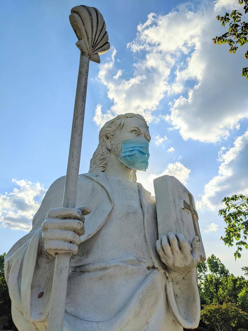 A statue of St. James the Greater in front of St. James Church in Concord bears a mask to show public solidarity during the COVID-19 pandemic. (Provided photo) 