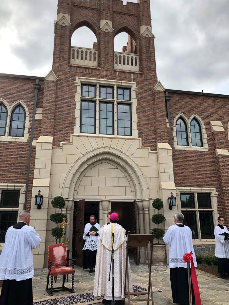 SJCS blessing Bishop Jugis looking up at crucifix in window 9 15 2020 SAH (Copy)