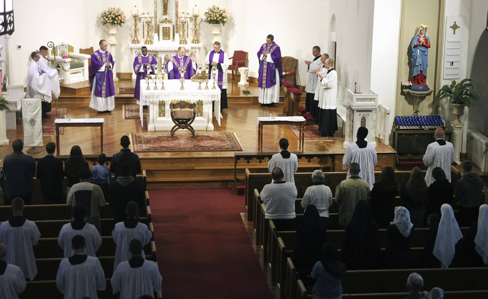 Concelebrating Mass with Bishop Jugis were Father John Putnam, judicial vicar, and Father Christopher Gober, diocesan vocations director.