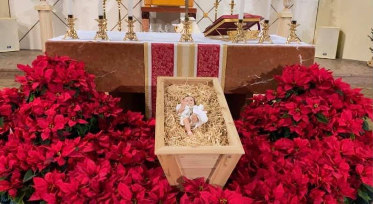 A scene from Christmas Mass offered by Father Richard Sutter, pastor, at St. Gabriel Church in Charlotte. (Photo via Facebook)