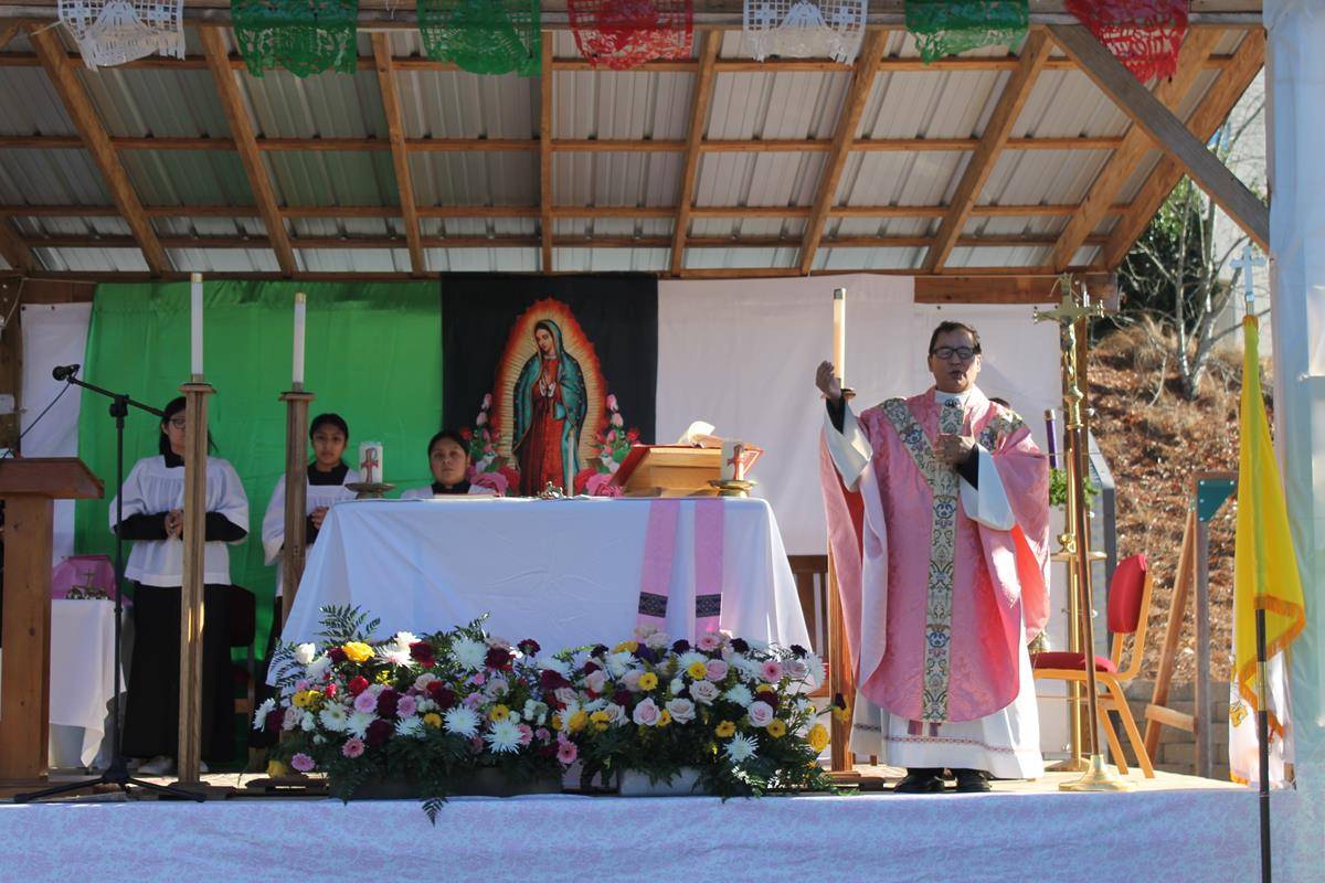 Father Fidel Melo, pastor of St. James Church in Hamlet, preaches during Mass in honor of Our Lady of Guadalupe. (Photo by César Hurtado)
