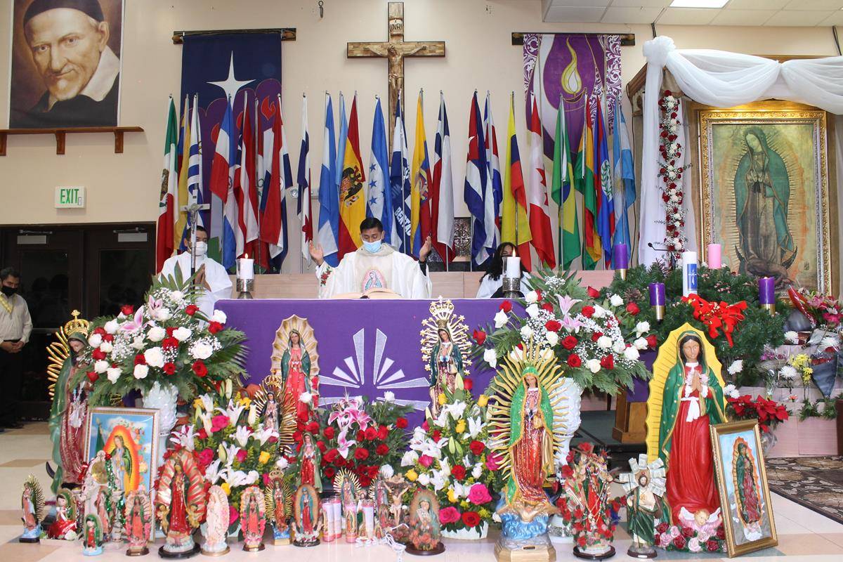 A detail of Our Lady of Guadalupe celebrations held in Charlotte. Note the many flags: Our Lady of Guadalupe is the patroness of all the Americas. (Photo by César Hurtado)