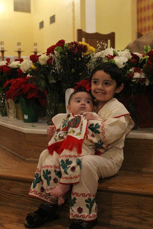Monroe's littlest parishioners dressed up in intricate traditional costumes for the feast day. (Photo by SueAnn Howell)