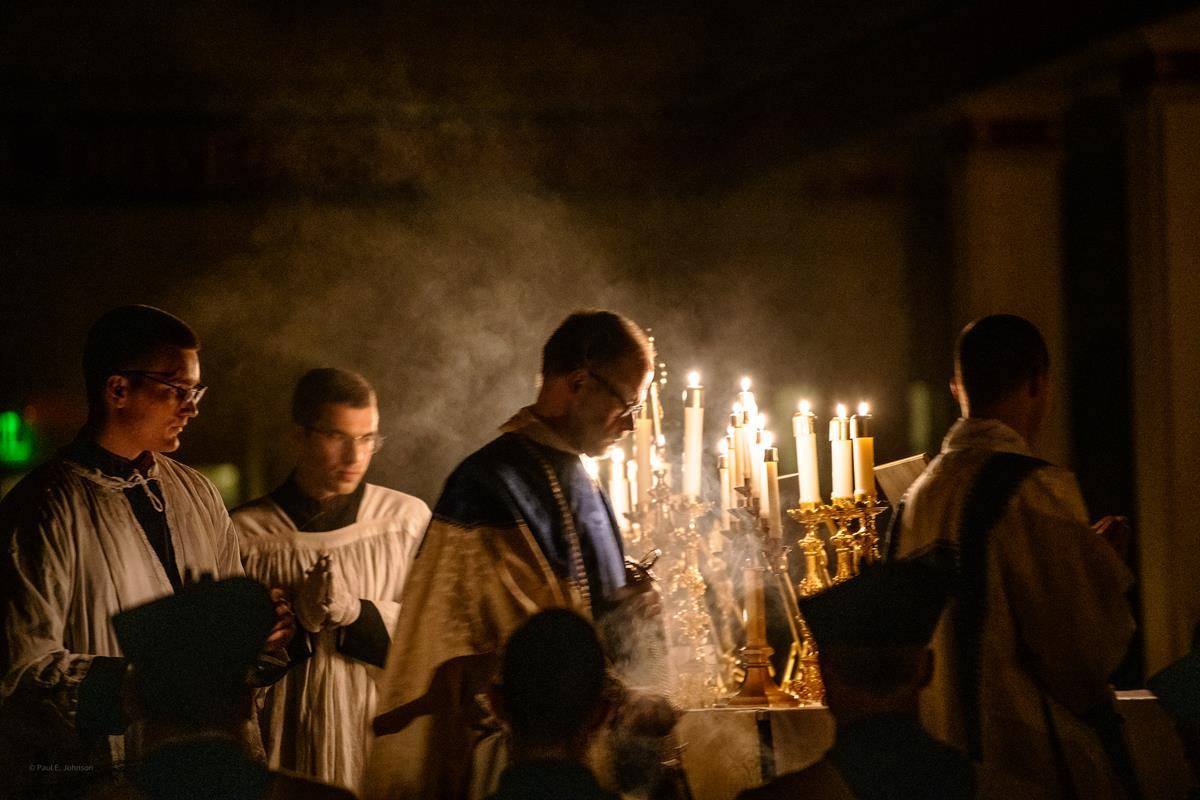 Fr. John Putnam offered St. Mark Parish’s first Rorate Mass Dec. 11 with parochial vicar Fr. Michael Carlson as deacon, and seminarian Christian Goduti as subdeacon. (Photo by Paul Johnson)