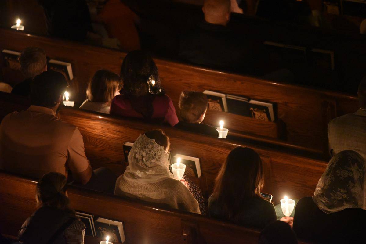 St. Ann parishioners take part in the Rorate Mass, a special Advent liturgy that is a Votive Mass of the Blessed Virgin Mary. (Photo by Markus Kuncoro)