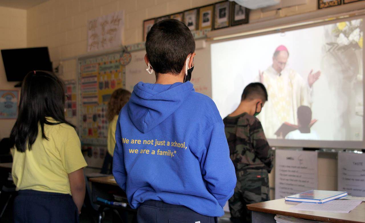 Students at Our Lady of the Assumption School in Charlotte participate in the livestream Mass with Bishop Peter Jugis Jan. 31 to kick off Catholic Schools Week. (Photos by César Hurtado, Catholic News Herald)