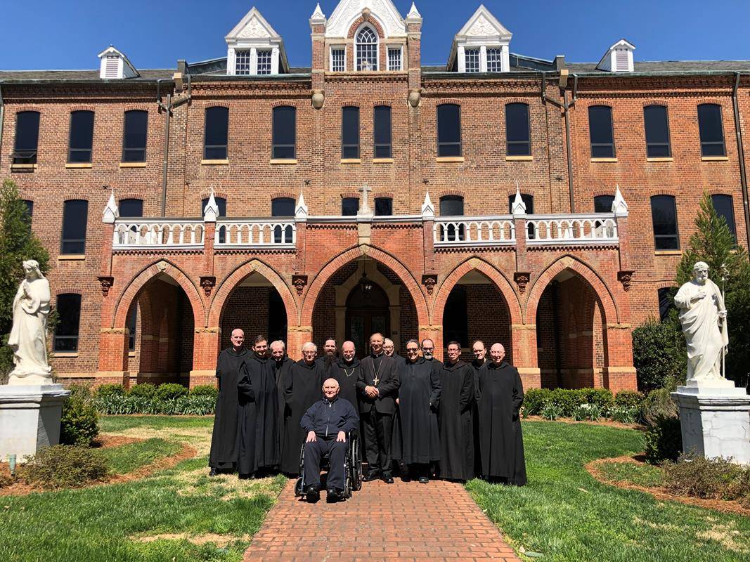  The monks of Belmont Abbey are pictured in front of the Belmont Abbey College administrative building with Benedictine Abbot Placid Solari and Bishop Peter Jugis  March 21, the feast of St. Benedict. 