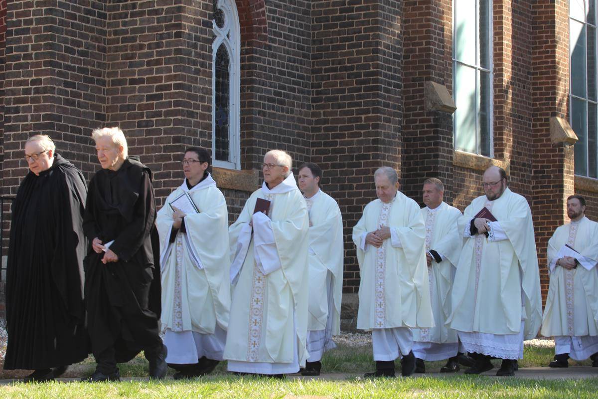The monks process into Mary, Help of Christians Basilica for the feast day Mass.