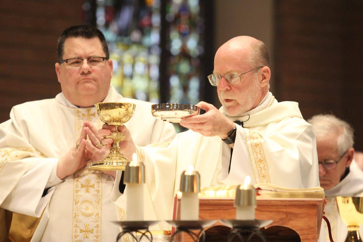 Deacon William Melton Jr. assists Abbot Placid at Mass for the community’s feast day. 