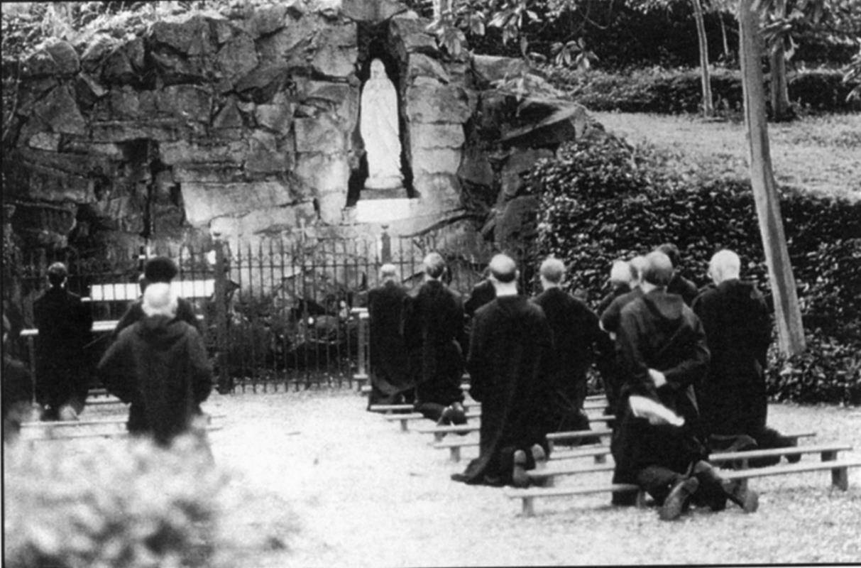 The monks of Belmont Abbey pray at the Our Lady of Lourdes Grotto located behind the monastery in this undated photo. Blessed as a pilgrimage shrine, the grotto was designated for the special purpose of praying for vocations.