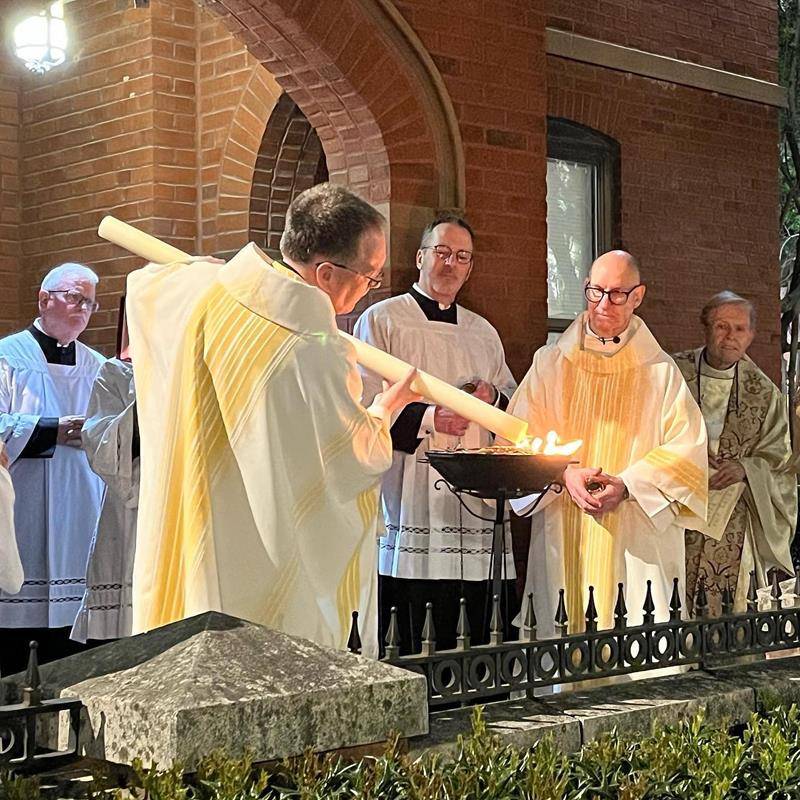 The new fire of Easter is lit at St. Peter Church in Charlotte. (Photo via Facebook)