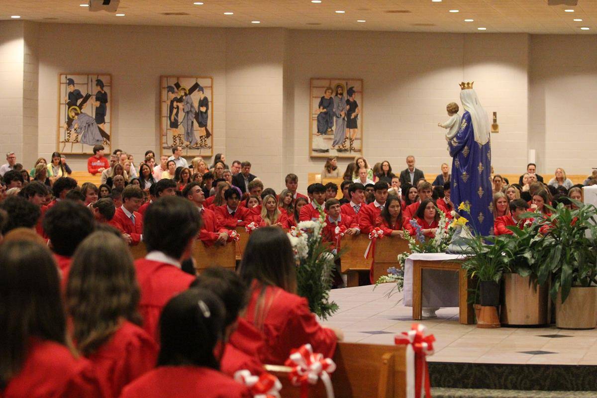 Members of the Charlotte Catholic High School Class of 2022 are all smiles during a baccalaureate Mass offered at St. Matthew Church May 24.  (SueAnn Howell | Catholic News Herald)