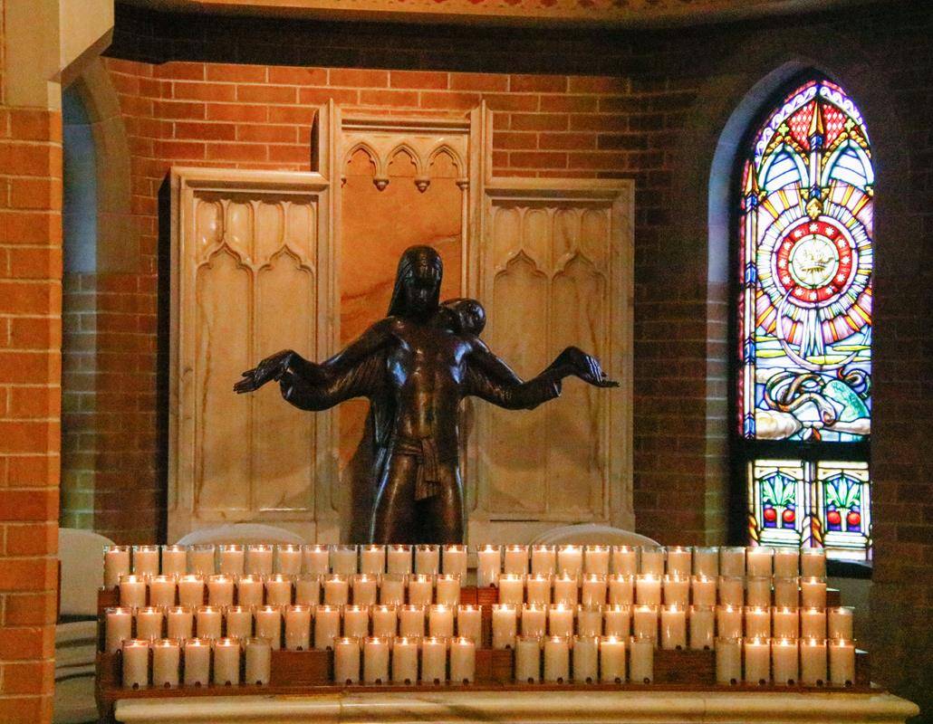 The bronze pieta sculpture creates a contemplative prayer space to offer intentions to the Sorrowful Mother and her Son. 