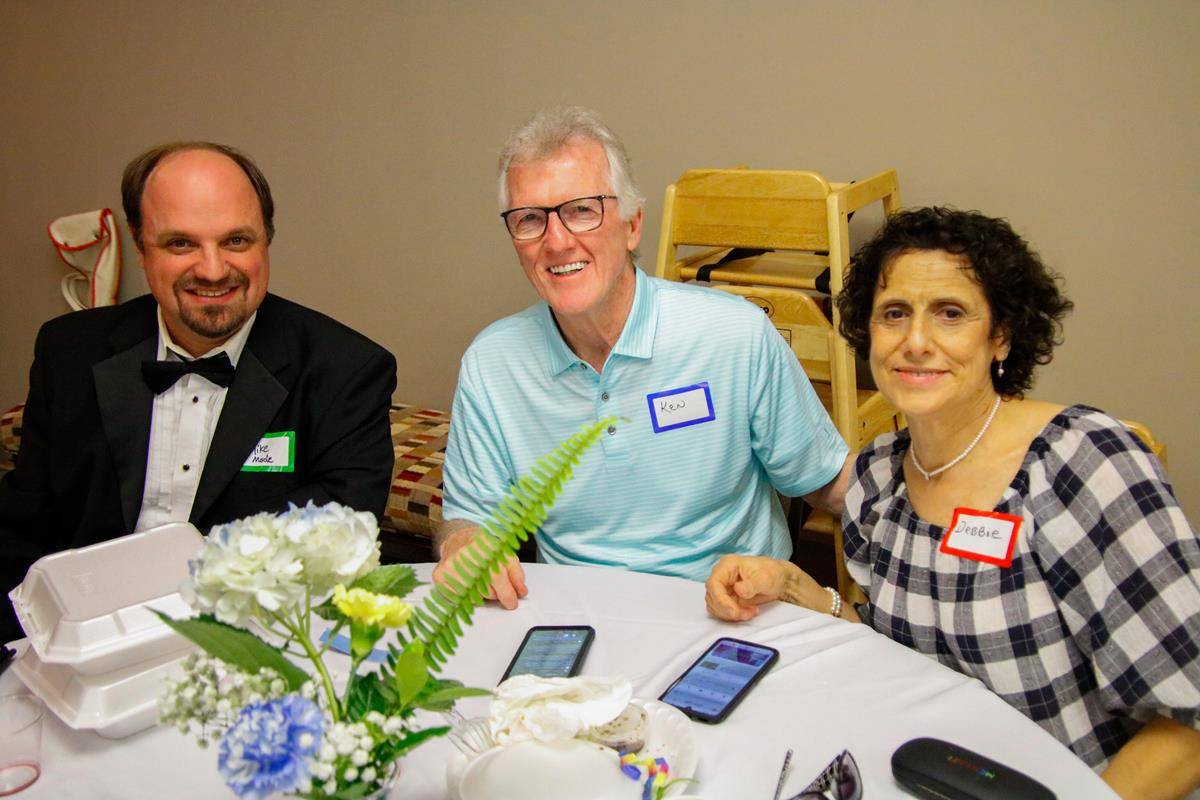 Mike Mode and Debbie and Kenny Markowski celebrate together.