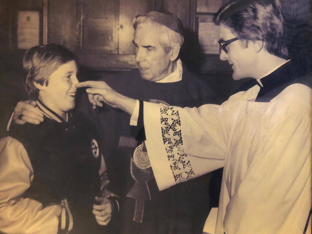 Archbishop Sheen speaks with a Columbian Squire of the Knights of Columbus youth organization. 