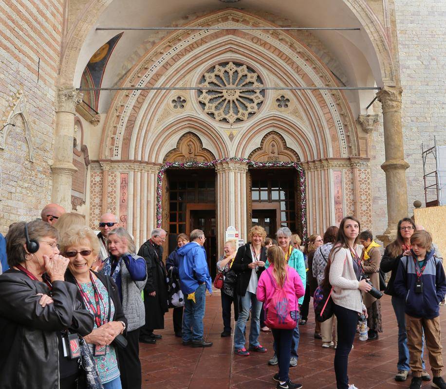 Pilgrims in front of Holy Door of Mercy at the Papal Basilica of St Francis, Assisi