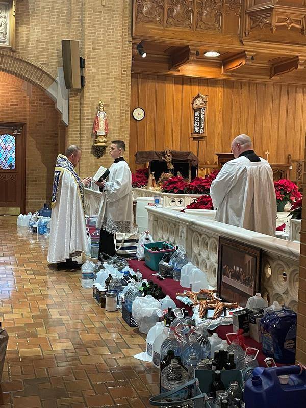 Blessing the Epiphany water at Our Lady of Grace in Greensboro.