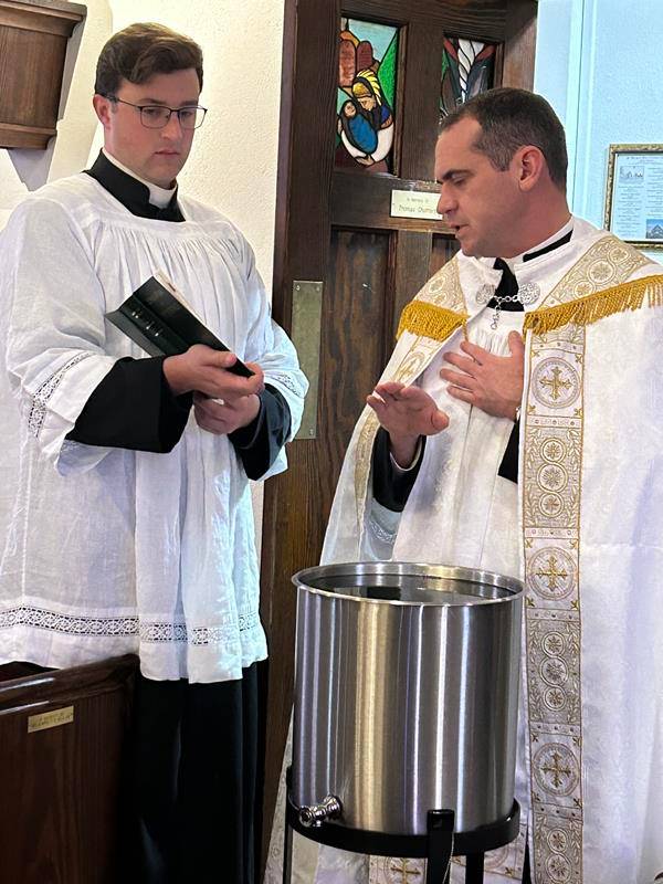 On Jan. 7, Father Brian Becker blessed the water and chalk for the faithful to use in the Epiphany blessing at the homes of St. Margaret Mary parishioners. He was assisted by seminarian Nicholas Kramer.