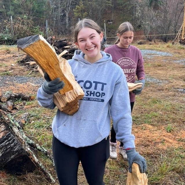 Mary, Mother of God Sylva carrying logs