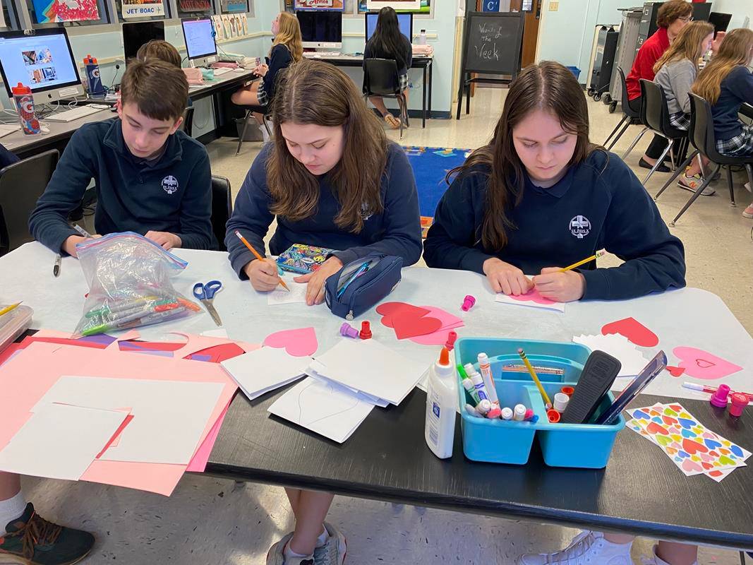 Seventh- and eighth-grade St. Pius X students made cards for residents of Dolan Manor senior apartments and collected socks and hand soaps for Urban Ministries in Greensboro.