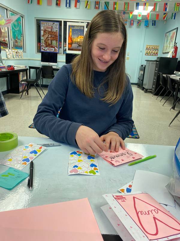 Seventh- and eighth-grade St. Pius X students made cards for residents of Dolan Manor senior apartments and collected socks and hand soaps for Urban Ministries in Greensboro.