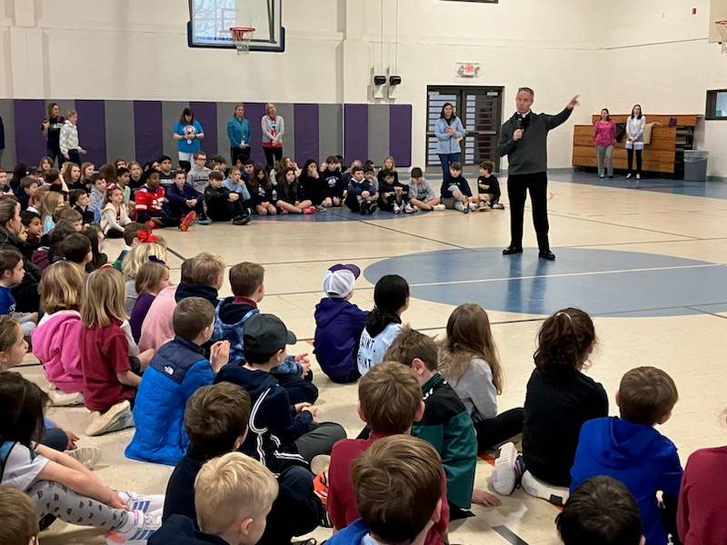St. Ann School in Charlotte began Catholic Schools Week with a visit from Father Timothy Reid, pastor of St. Ann Church, who shared his vocation story.