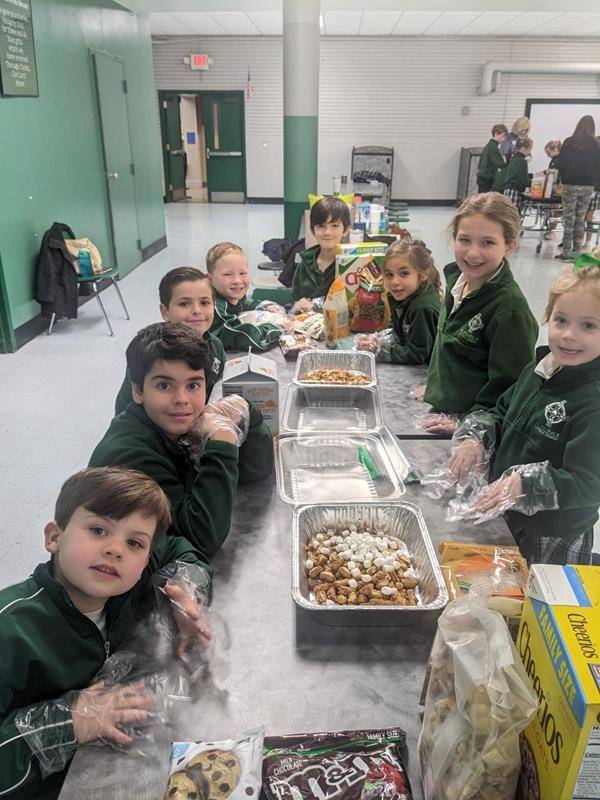 The students at St. Patrick School packaged Snackwells to be sold during lunch, and the monies will be donated to Cross Catholic Outreach to support a clean water project.  