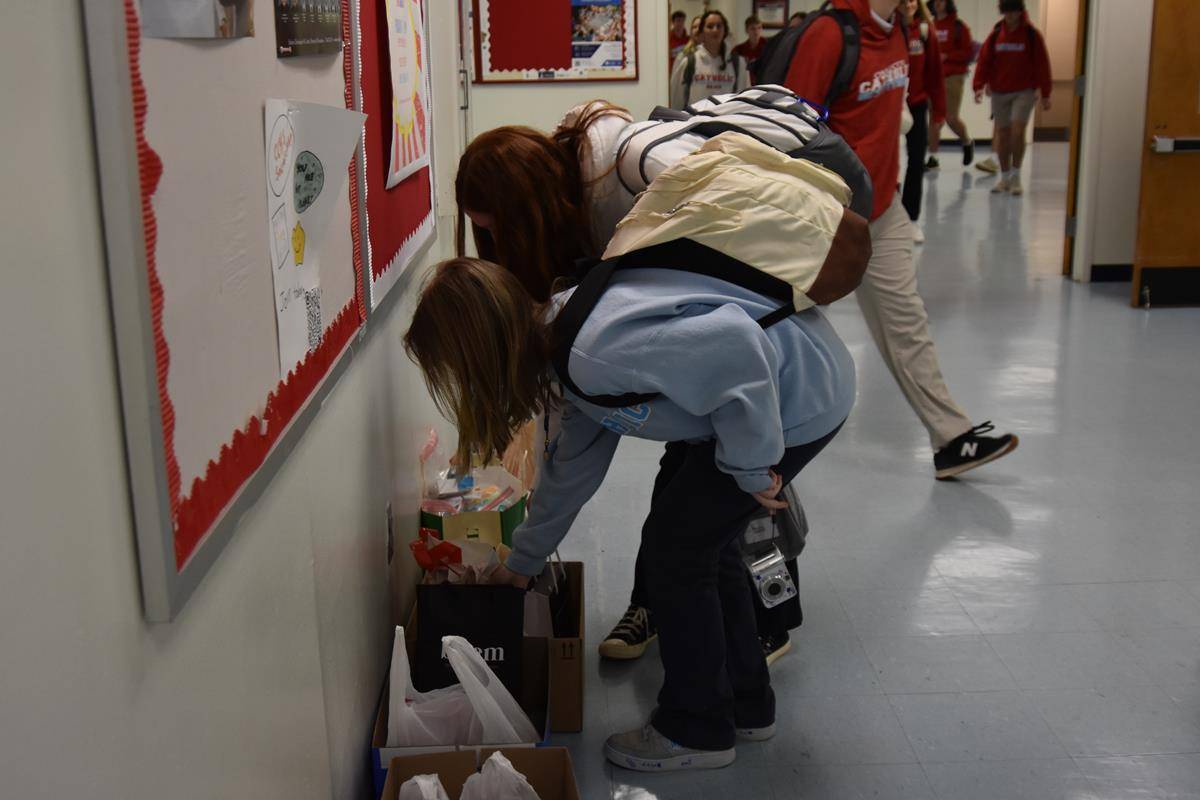 Students at Charlotte Catholic High School started a supplies drive for Catholic Charities and prayed the Joyful Mysteries of the Rosary with the other diocesan schools. 