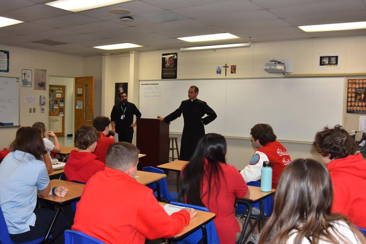 Father Brian Becker visited Charlotte Catholic classrooms to talk about vocations.