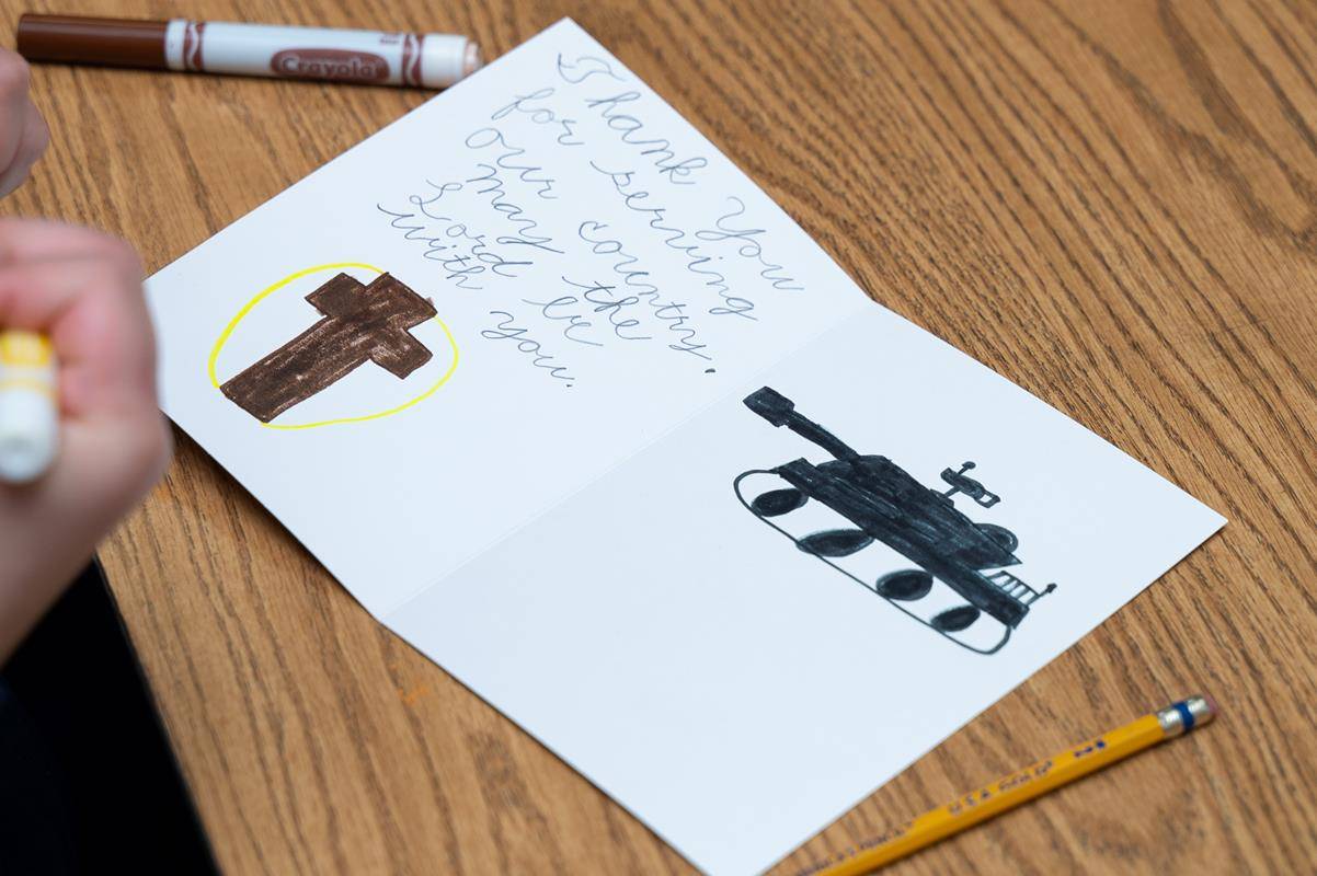 Students at Our Lady of the Assumption School make cards to send to veterans during Catholic Schools Week. 