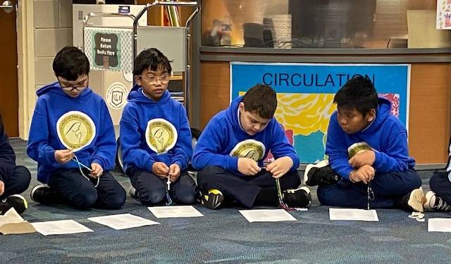  Our Lady of the Assumption School students prayed the rosary.