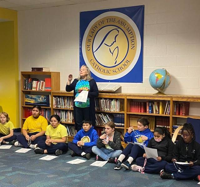  Our Lady of the Assumption School students prayed the rosary.