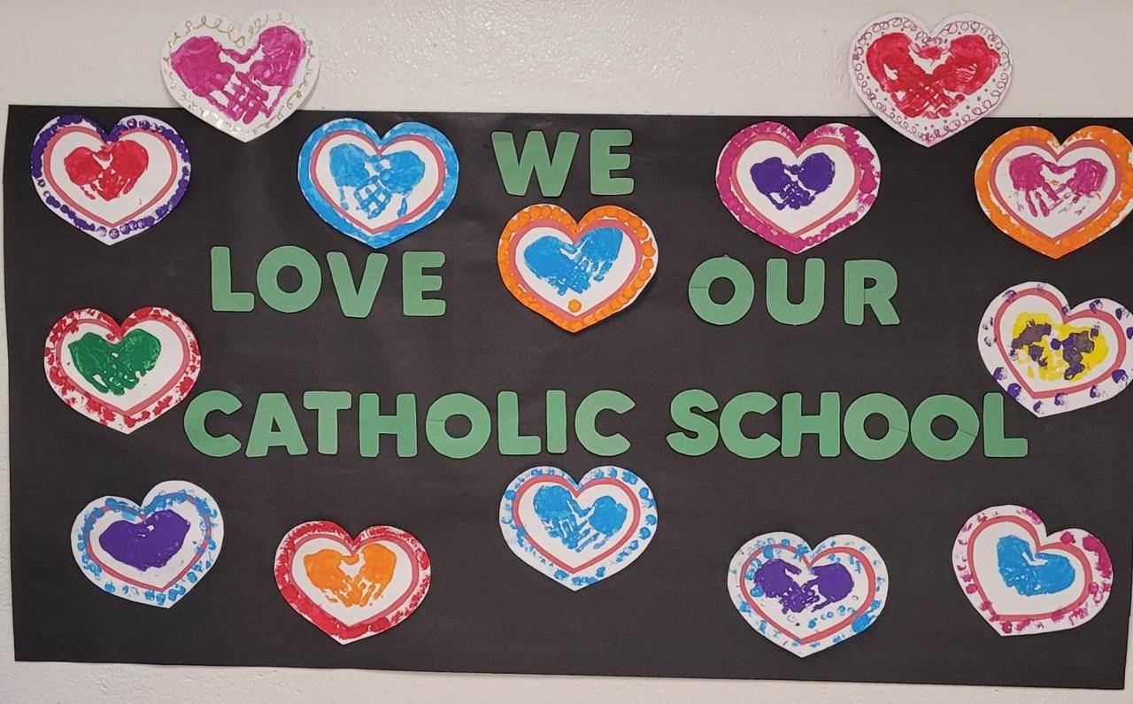 Pre-K students at St. Michael School display their beautiful handprint hearts out of love.