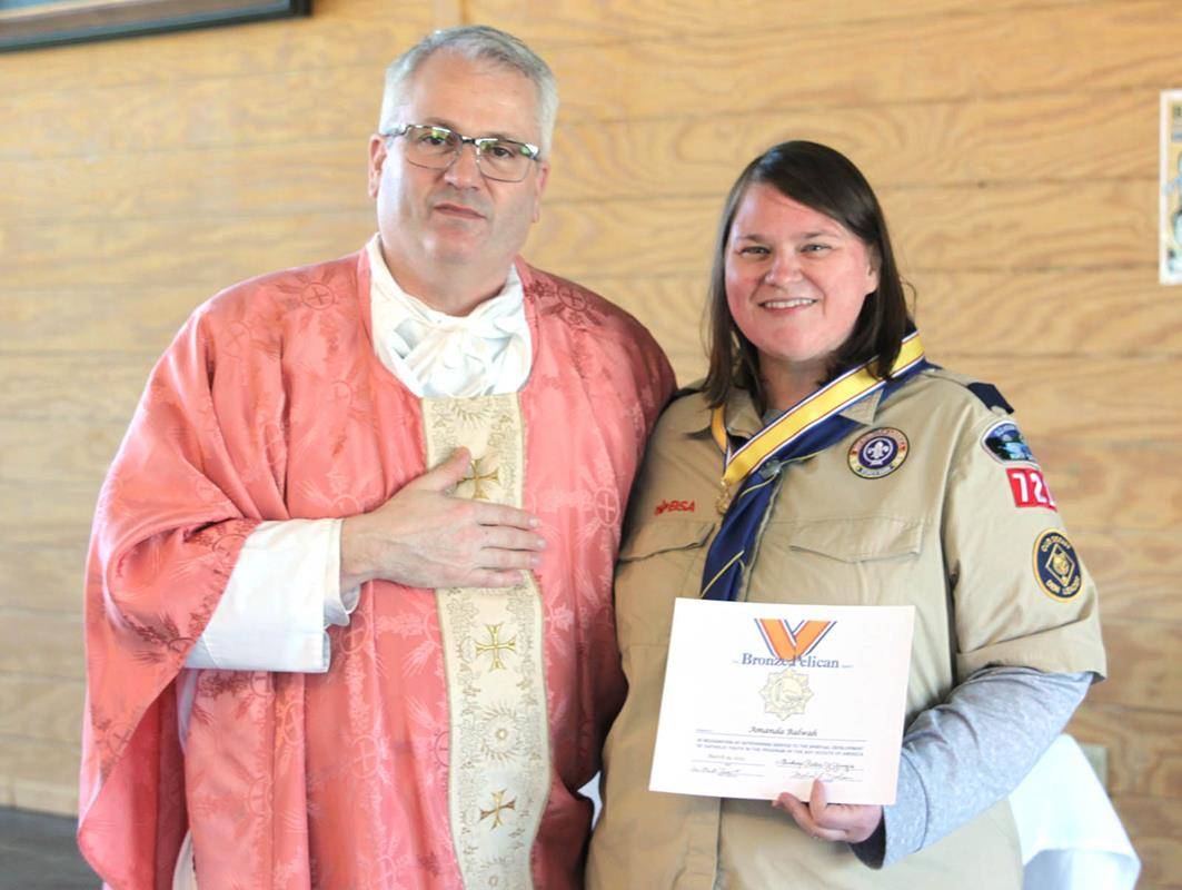 Amanda Balwah of Pack 721 in Winston-Salem was one of three recipients of Catholic Scouting's adult emblem, the Bronze Pelican. (Photo by Patricia Guilfoyle)