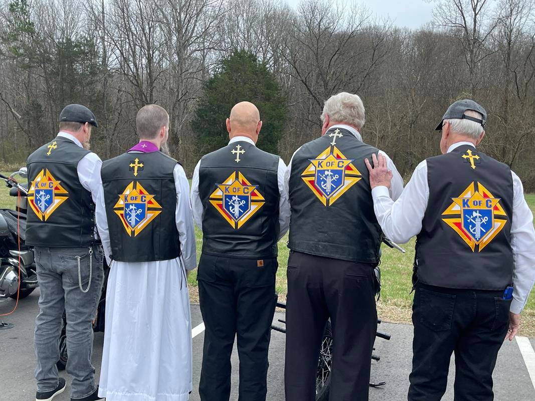 Father Miller w KofC bikers showing vests after install 2023 FB (Copy)